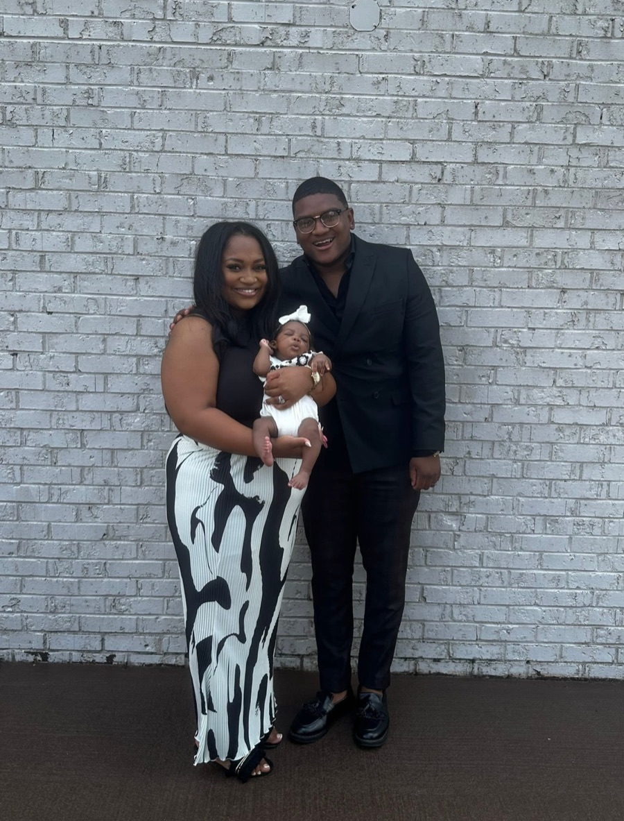 Barry Briggs with his wife and their baby